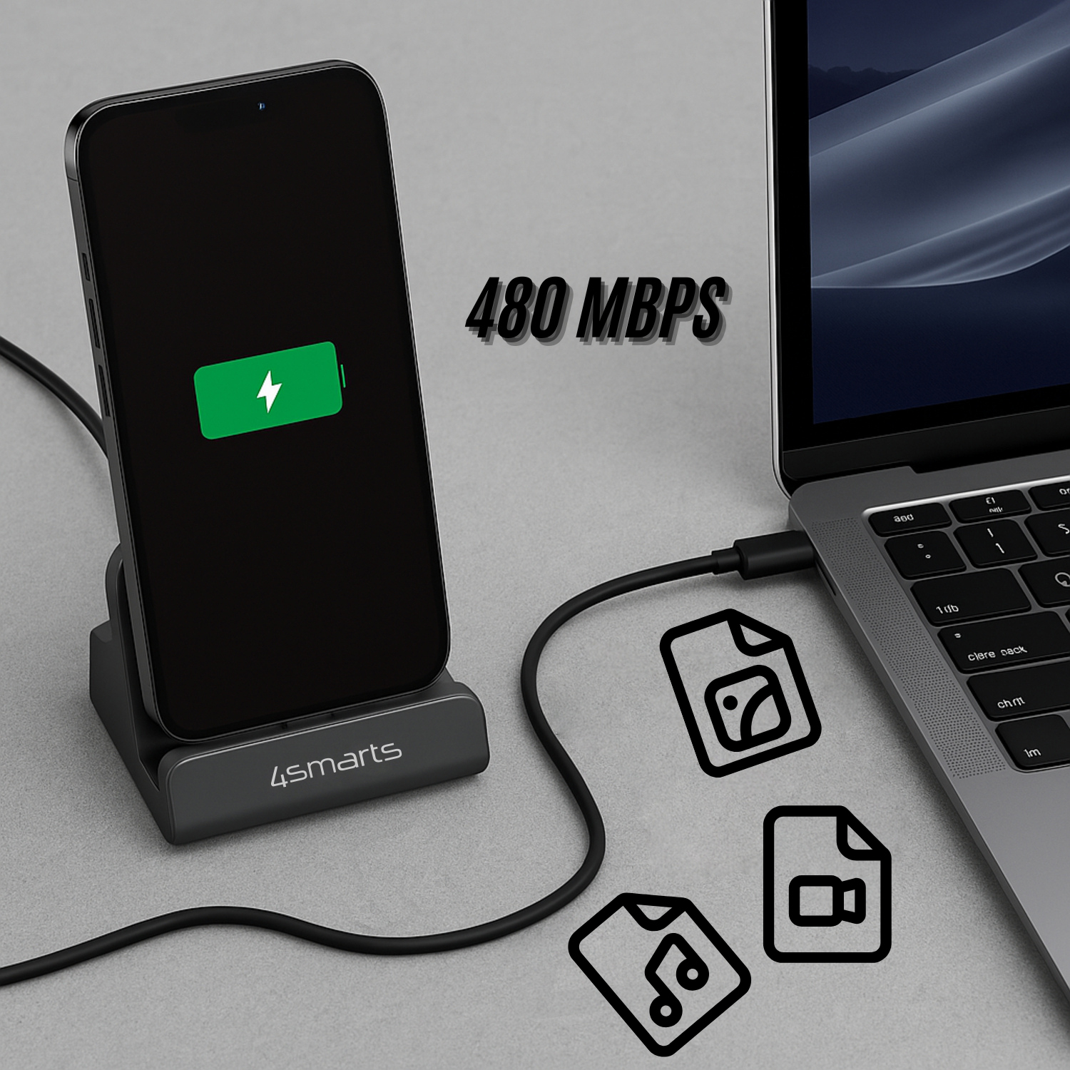 Smartphone charging in 4smarts dock, connected to a laptop – icons for music, photos, and videos highlight the 480 Mbps data transfer speed.