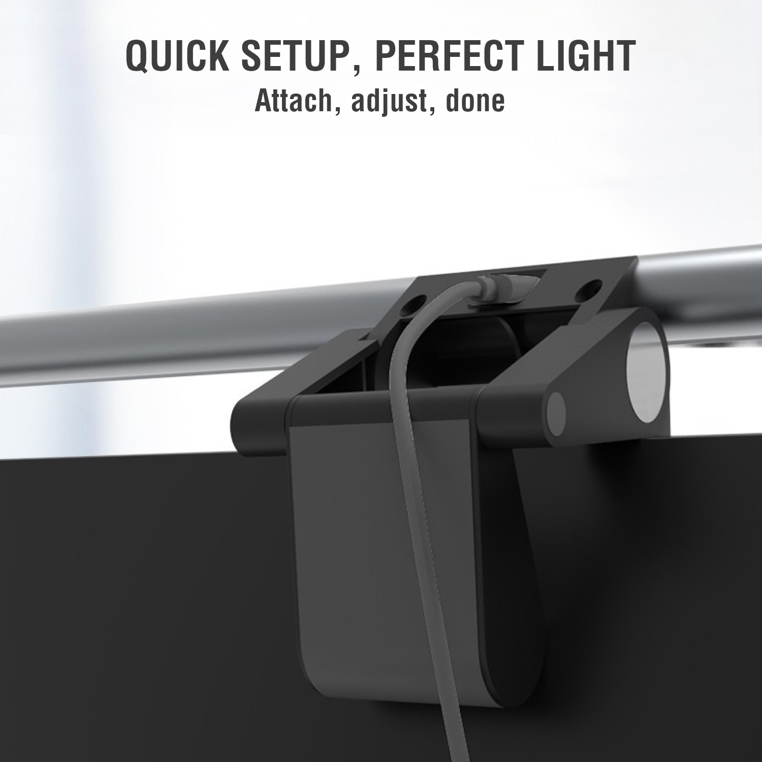 Close-up of the screenbar clip mount with USB power connection on the monitor.